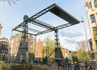 Fototapeta na wymiar Large Amsterdam Canal Swing Bridge, Amsterdam, The Netherlands