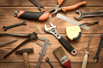 Labor day. Various tools on a wooden table.