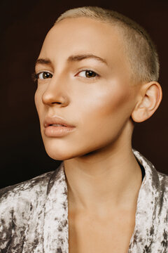 Beautiful woman with blonde short haircut. Art fashion editorial portrait made in studio with perfect retouch.