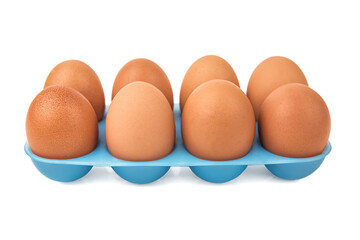ten eggs in a tray on white