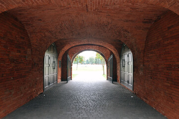 Obraz premium Narrow passage with a dark tunnel in the fortifications of the Brest Fortress.