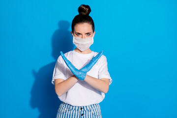 Portrait of her she nice attractive strict serious girl showing stop sign crossed arms symbol ban illness preventive measures medicine isolated on bright vivid sine vibrant blue color background