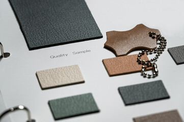leather swatch book with various different colors.