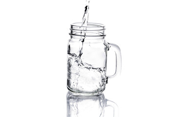 mason jar with water isolated on white