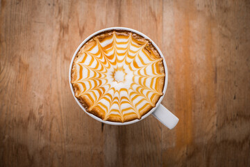 hot coffee with foam milk art, latte art coffee ( Filtered image processed vintage effect.)