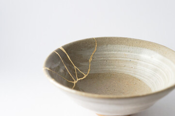Japanese kintsugi ceramic chawan bowl restored with real gold. Antique pottery kintsukuroi.