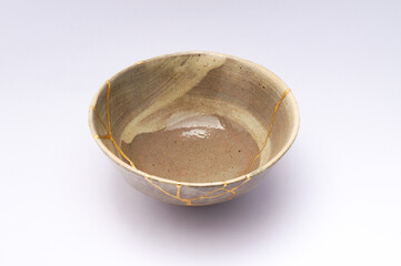 Japanese kintsugi ceramic chawan bowl restored with real gold. Antique pottery kintsukuroi.