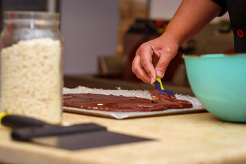 Cooking concept. Professional confectioner making chocolate candies.Preparation handmade chocolate, close up.