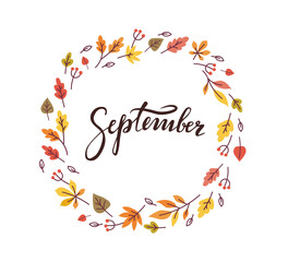 Fototapeta premium September word handwritten lettering in colorful autumn leaves wreath. - Vector illustration