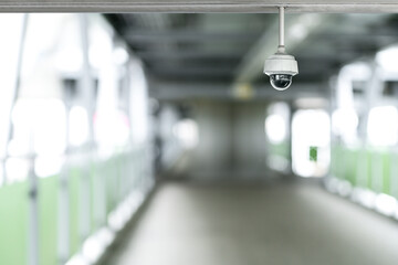 CCTV camera security system  for monitoring safety with blurred public corridor background