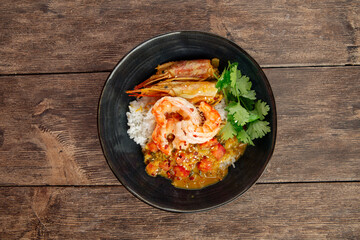 Asian dish curry with langoustines and hikari rice