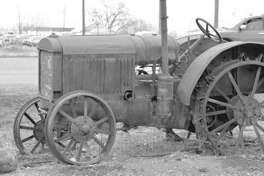 Disused tractor in black and white