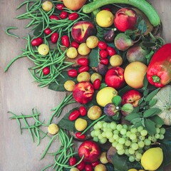 closeup of a top view fruit and vegetable composition - fresh and healthy food