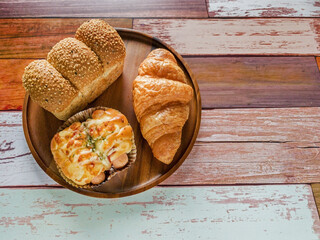 Bakery breakfast on wooden plate