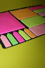 set of colorful stickers for notes on a yellow background