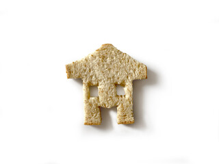 Bread slices that are cut into Cut into a house and whole wheat bread slices with clipping path. Smells delicious Placed on white background. Ideas and concepts Comparative and Business.