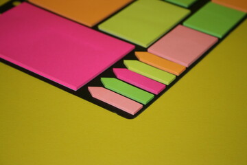 set of colorful stickers for notes on a yellow background