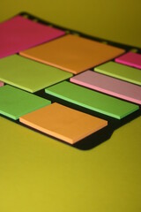set of colorful stickers for notes on a yellow background