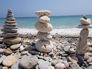 Fototapeta na wymiar stones on the beach, standing tall