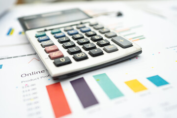 Calculator on chart and graph spreadsheet paper. Finance development, Banking Account, Statistics, Investment Analytic research data economy, Stock exchange trading, Business company concept.