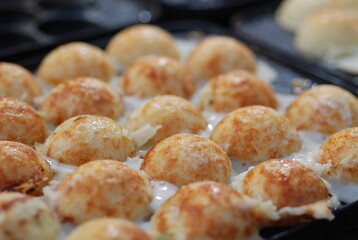 Takoyaki in a pit pan before selling.