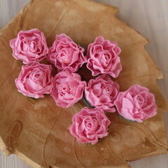 Artificial flowers made out of fabric in beautiful pastel rose pink color. This handmade flower can be used as decoration on headband, dress, and many other as craft supply material.