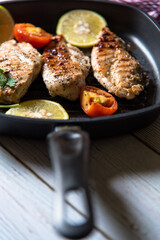 Vertical view of grilled steaks on a pan with use of selective focus