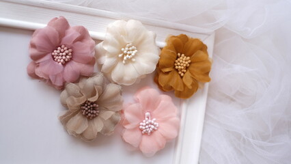 Artificial flowers made out of fabric in beautiful pastel colors