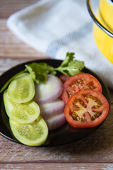 Fresh vegetable salad on a plate with use of selective focus