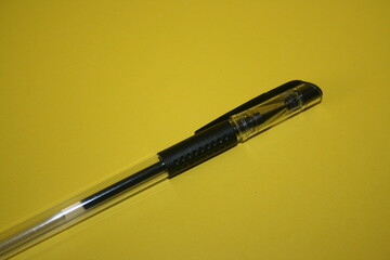 a picture of gel pen on a yellow background