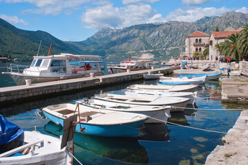 Fototapeta na wymiar The view to the bay of the Perast city with boats in Montenegro