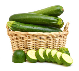 fresh zucchini's (Cucurbita pepo) in basket on a white background