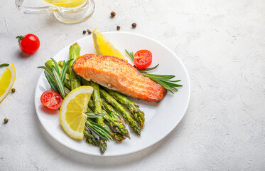 Delicious lunch, baked salmon with asparagus