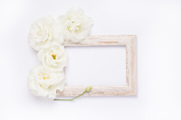 wooden photo frame with white flowers mockup