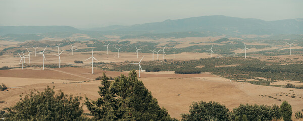 Panoramic of natural landscape with windmills.