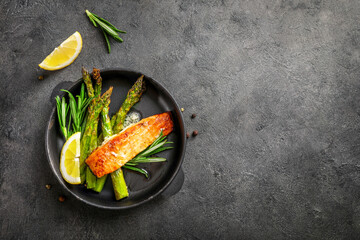 Delicious lunch, baked salmon with asparagus