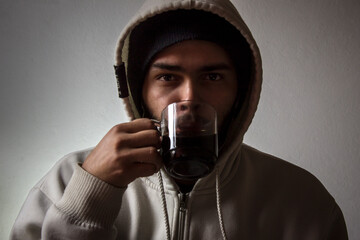 portrait of a man with a glass of coffee