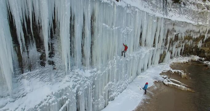 An ice climber on a frozen waterfall on Lake Superior in Northern Michigan 