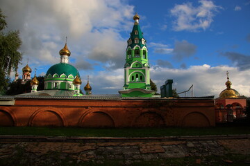 green church with golden domes