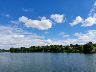 Summer rural landscape, lake and sky