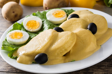 Traditional Peruvian papa a la huancaina on gray background	