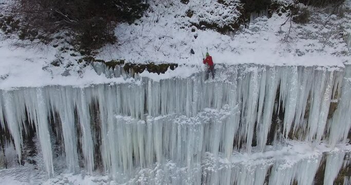 An ice climber on a frozen waterfall on Lake Superior in Northern Michigan 