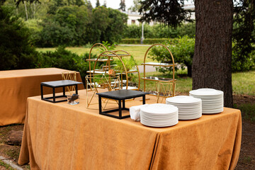 table and chairs in the  garden. Wedding banquet