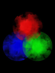 Blue, green and red spots of watercolor paint on black background