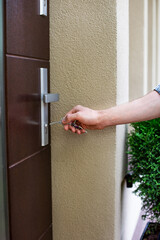 Vertical view of opening, closing the front door of the house.