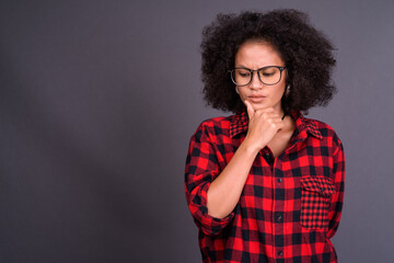 Young beautiful African hipster woman with eyeglasses