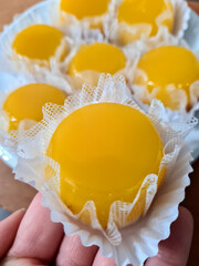 Quindim is a sweet with the ingredients of egg yolk, sugar and grated coconut. They are delicious...