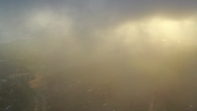 The marine layer drifts in from the Pacific Ocean over the San Francisco Bay and into the East Bay hills. This air mass develops over the ocean in the presence of a temperature inversion.