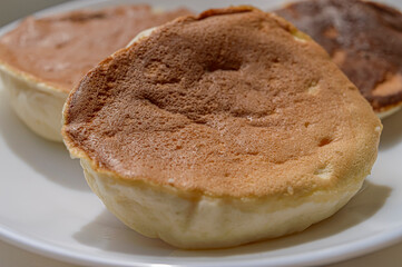 sweet pancakes with breakfast in a white plate a brick wall