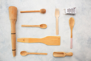 Kitchen wooden spoons for sugar, spices, honey on gray background